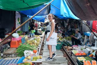 self portret Maeklong railway market Thailand