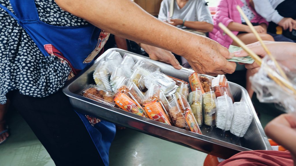 vendors selling food on train Thailand