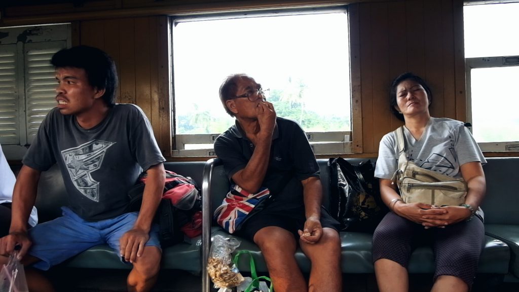 on a train from Bangkok to Kanchanaburi Thailand