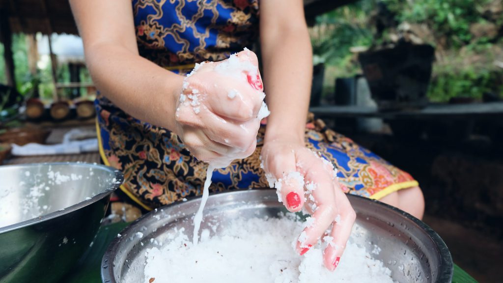 Making coconut milk Thai cooking class