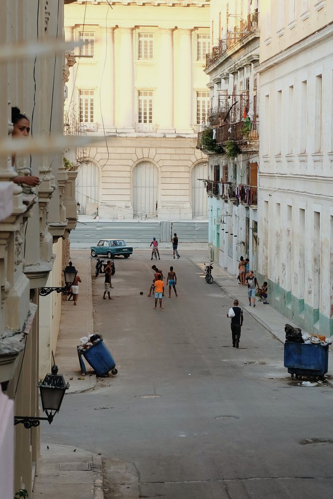 Cuban kids playing soccer streets Havana Cuba