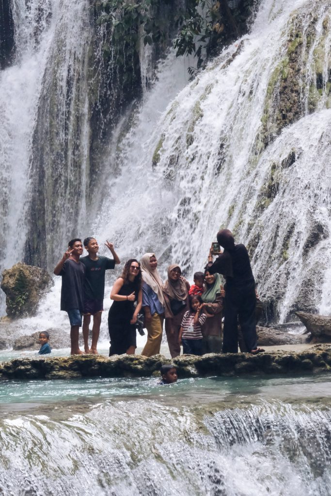 picture with locals at waterfall Luwuk Sulawesi
