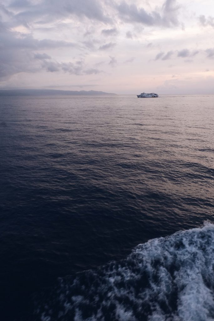 boat sailing ocean sunset